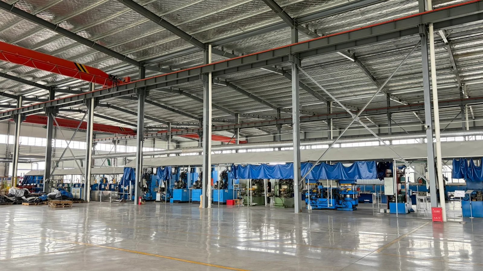 DEWIN production floor showing compression molding presses